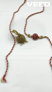 Handcrafted Om Rakhi & Jhumka Lumba Set – Traditional Raksha Bandhan Bhaiya Bhabhi Rakhi with Pearl Detailing & Red Gold Thread (Pack of 2 Pcs)