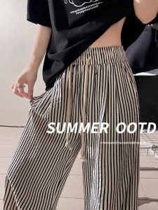 กางเกงขายาวทรงหลวมเอวสูงลายทางแนวตั้งสีดำขาวสำหรับผู้หญิงไซส์ใหญ่ กางเกงขายาวทรงหลวมสบายๆ สำหรับฤดูร้อน
