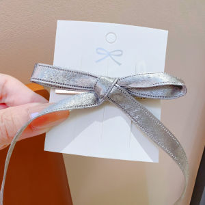 Silver Bow Streamer Hair Clip