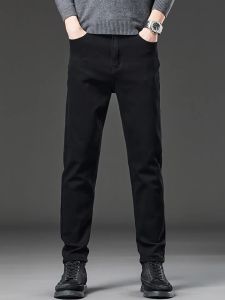 2025 ขายร้อนในสต็อก กางเกงยีนส์ผู้ชายมีซับในฟลีซฤดูใบไม้ร่วงฤดูหนาว สีดำบริสุทธิ์ ยืดหยุ่น ทรงเข้ารูป กางเกงขายาวตรง