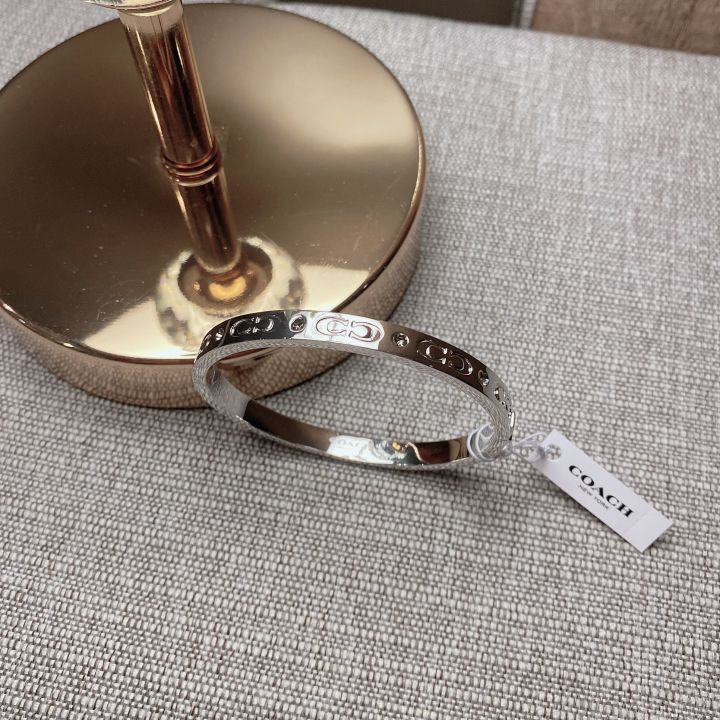 Coach kissing c on sale bangle