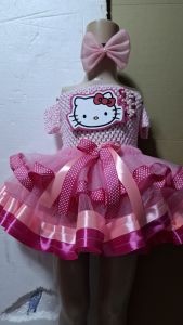 Hello Kitty dress with pink bow and tutu skirt. Off-shoulder design with polka dot ribbons and satin trim.