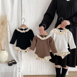 New autumn/winter baby romper with lace trim round neck hollowed-out ribbed design long sleeves and lace trim at the hem.