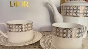 Elegant White Ceramic Tea Set with Geometric Pattern Cups and Saucers