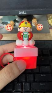 Thần tài mini móc khóa phát nhạc treo trang trí hoặc loại để bàn trang trí xe ô tô mang tài lộc