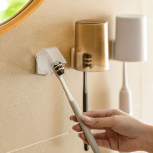 ชั้นเก็บของแปรงสีฟันในห้องน้ำชั้นเก็บของแบบมีกาวในตัวที่จับแปรงสีฟันกันฝุ่นอุปกรณ์ในห้องน้ำ