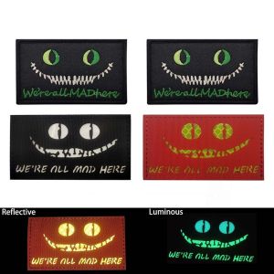 WERE ALL MAD HERE Morale EmblemCheshire Cats Eye Glow On the Dark Reflective PatchesTactical Badges Embroidery Applique