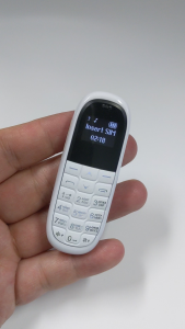 Dual SIM โทรศัพท์มือถือ aeku KK1ไร้สายบลูทูธหูฟังโทรศัพท์มือถือมินิโทรศัพท์สเตอริโอ Super Thin GSM Long Standby โทรศัพท์มือถือ