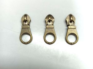 (แพ็ค12ชิ้น)หัวซิปสำหรับฟันไนล่อนเบอร์5 เหลืองรมดำ เลือกจำนวนได้ตามต้องการ