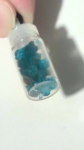 blue apatite crystal chips in bottle pendant necklace