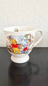 Tokyo Disneyland ceramic mug (Winnie the Pooh holding a honey pot & Piglet sitting on a chair)