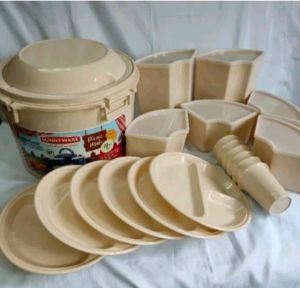 Cream 20-piece picnic set with partition plates tumblers containers and a bucket for beach outings and picnics.