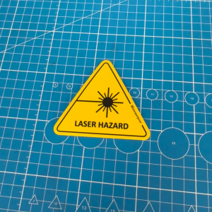 Laser Hazard. Caution Triangle Sticker Sign Warning Beware Danger Safety Label. Bright Light Beam Radiation Aperture.