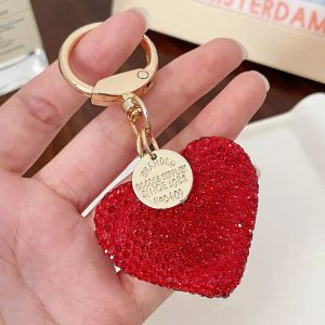 The shiny rhinestone heart-shaped keychain is the perfect Valentines Day gift for ladies including key bags and earphone cases