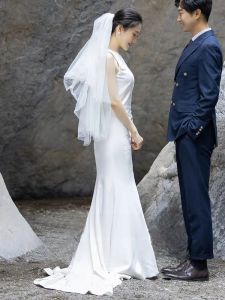 ชุดเดรสยาวแขนกุดเอวกลางสไตล์ฝรั่งเศสสีขาวสำหรับผู้หญิงวัย 18-25 ปี ชุดแต่งงานสไตล์หวานสำหรับการถ่ายภาพท่องเที่ยวในฤดูใบไม้ร่วง