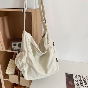 Casual Street สไตล์ผู้ชายกระเป๋าสะพายข้างผ้าใบสีเรียบง่ายอเนกประสงค์กระเป๋าสะพายไหล่สําหรับเยาวชน