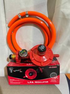 The LPG Regulator comes with a pressure gauge for accurate monitoring. It  includes a free 1.5-meter hose and 2 clamps for secure installation. This  certified product has a quality license number Q-6694 ensuring reliability  and compliance with standard
