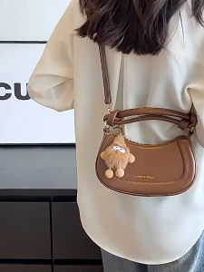 Movi Katie Túi Xách Thắt Nút Phong Cách Hàn Quốc Mẫu Mới Mùa Xuân Với Mặt Dây Chuyền Sang Trọng Dễ Thương Túi Đựng Bánh Bao Nhỏ PU Mềm Túi Đeo Chéo Dễ Phối Hàng Ngày
