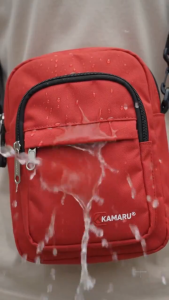 KAMARU RAM Cross Body Bag Compact Durable Reliable Water Resistant Spacious Main Zippered Pocket Secondary Front Pocket Zippered Front Pocket Compact Dimensions 17.1 x 7 x 21.6 cm.