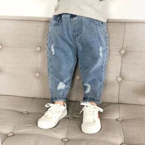 Childrens Clothing Spring and Autumn Childrens Jeans New 0-6 Year Old Boys Loose Hole Long Pants Solid Color Girls Baby Pants