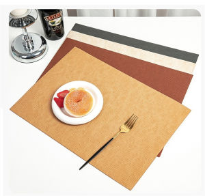 Stylish woven-pattern rectangular leather placemats heat-resistant and non-slip perfect for modern home decor.
