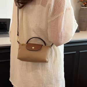 PIYU Fashionใหม่สไตล์เกาหลีพรีเมี่ยมสไตล์วินเทจสตรีกระเป๋าสะพายไนล่อนเกี๊ยวกระเป๋าแฟชั่นร้อยผู้หญิงใต้วงแขนกระเป๋าสะพายกระเป๋าถือหรูหรา