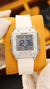 SKMEI กล่องสี่เหลี่ยมจตุรัส Jam Tangan Elektronik ทันสมัยกันน้ำ30เมตรนาฬิกาสไตล์สปอร์ตอเนกประสงค์นาฬิกาเรืองแสงสำหรับผู้ชายและผู้หญิง2526