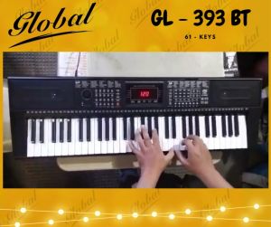 GLOBAL KEYBOARD GL 393 BT BLUETOOTH COMPATIBLE 61 standard sized KEYS USB MP3 SPLIT KEYBOARD AUDIO & HEADPHONE OUTLET 3 LEARNING MODE Program Record Play Function Metronome Single / Multi Fingered Tanspose Vibrato Sustain Volume Rotary Knob AC/DC power