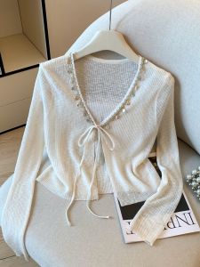 เสื้อคาร์ดิแกนถักไหมน้ำแข็งสไตล์โบฮีเมียน แขนยาว บาง โปร่งแสง ป้องกันแสงแดด สำหรับผู้หญิง ฤดูร้อน 2025 คอวี ปกโปโล