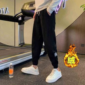 กางเกงวอร์มผ้าคอร์ดูรอยหนาสำหรับผู้ชาย ทรงหลวม ทรงหลวม ทรงลำลอง กางเกงขายาวสีพื้น กางเกงขายาวทรงหลวม สไตล์เกาหลี