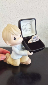 Precious Moments boy holding a ring case