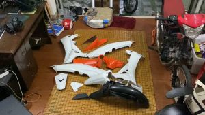 Bộ vỏ nhựa xe máy Sirius hàng Việt Nam loại 1 màu Trắng nhám Cam