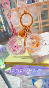 ✨ พวงกุญแจ น้องหมีเนย มีน้ำและตุ๊กตาด้านใน สีสันสวยงาม มีกระดิ่งส่งเสียง เก๋ๆ