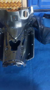 BATOK BELAKANG DAN LEGSHILD TENGAH KONTAK SUPRA 125 F1 INJEKSI KARBON