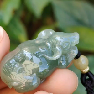 Oil Green Natural Type A Jadeite Pendant carved as water buffalo representing Hardworking and Simple Unstoppable Strong and Healthy and Turn the Tide certificate include weighs 14.56 grams 34.6 * 23.6 * 11.5 mm suitable for daily wear (pendant80)