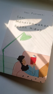 Buku Seni menertawakan beban hidup