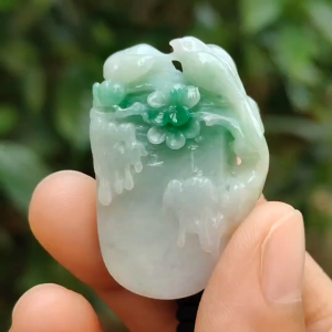 Beautifully crafted with birds and flower light green Natural Type A Jadeite Jade as Pendant certificate weighs 18.63 grams measurement 38.3 * 25.9 * 9.6 (pendant247)
