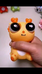 Various squeeze eye dragons keychain squeeze eye dragons keychain fluid bears squeeze eye caterpillars and pandas gifts.