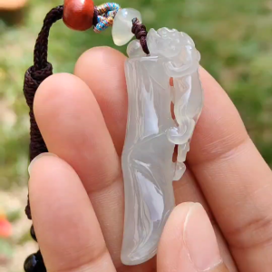 Premium Semi Icy with Light Green Hue Natural Type A Jadeite Jade crafted with Pixiu as a Pendant certificate included weigh 12.61 grams measurement 492. * 17.1 * 8.7 mm (pendant202)