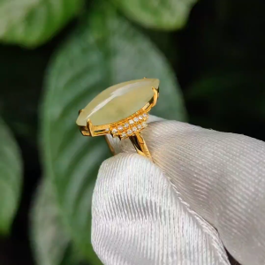 Elegant Tea Green (Yellow) Marquise cabochon 14.8 * 6.2 * 3.8 mm Natural Type A Jadeite Jade set on 18k Gold as a Ring with diamonds certificate included weigh 2.21 grams (18kring15)