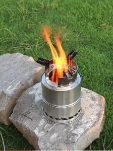 กีฬากลางแจ้งพับเตาไม้กลางแจ้งภูเขาตั้งแคมป์บาร์บีคิวครัวเรือนกระติกน้ำร้อนเตาไม้แบบพกพา ส่งถุงเก็บตาข่าย