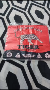 PLASTIK TIGER WARNA MERAH UK 28 LOGO PUTIH