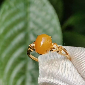 Yellow with a bit reddish Natural Type A Jadeite Jade Cabochon 8.6 * 7 * 3.6 mm set on 18k Gold as Ring adding 2 diamonds with certificate weigh 2.08 grams finger size 16.8 mm (18kring13)