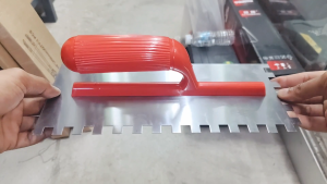 CN Steel Mosaic Cement Trowel With L-Shape Notch 10MM Teeth 120MM (W) x 280MM (L) - Red PVC Handle