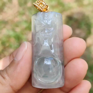 Premium Icy Translucent Light Green Natural Type A Jadeite Jade crafted with Dragon set on 18k Gold as Pendant certificate weighs 12.99 grams measurement 46.8 * 19.7 * 7.7 mm (18kp43)