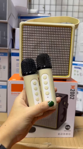 ลำโพงบลูทูธ รุ่นM2002 แถมไมค์ลอย2ตัว มีสายหิ้วพกพาง่าย รองรับAUX/TF/USB เพิ่มหรือลดเสียงได้