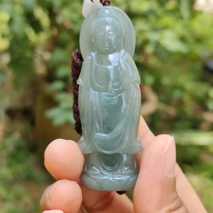 Good Quality Light Green Natural Type A Jadeite Jade crafted with standing Guanyin as Pendant certificate weighs 31.45 grams measurement 65.2 * 24.1 * 11 mm (pendant259)