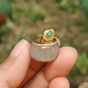 Premium Icy Natural Type A Jadeite Jade crafted and set on 18k gold with the shape of Drum as pendant adding diamonds and 1 green cabochon certificate included weigh 4.72 grams measurement 10.1 * 16.7 (18kp22)