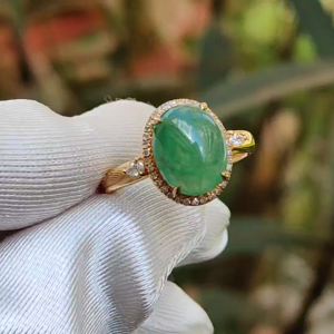18K Gold weigh 2 grams Setting with Natural Type A Jadeite Green Cabochon size 10.7 * 8.3 * 3.8 mm with 35 * 0.003 and 2 * 0.03 pear cut diamonds certificate included weigh 2.65 grams Finger ring size 17.3 mm