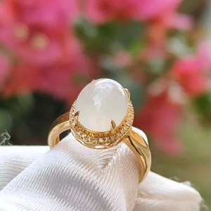 Icy Translucent Premium Quality Natural Type A Jadeite Jade crafted as Oval Cabochon set on 18k gold with diamonds as Ring with certificate weigh 2.54 grams Finger Size 15mm Measurement 9.9 * 8.2 * 4.5 mm (18kring22)